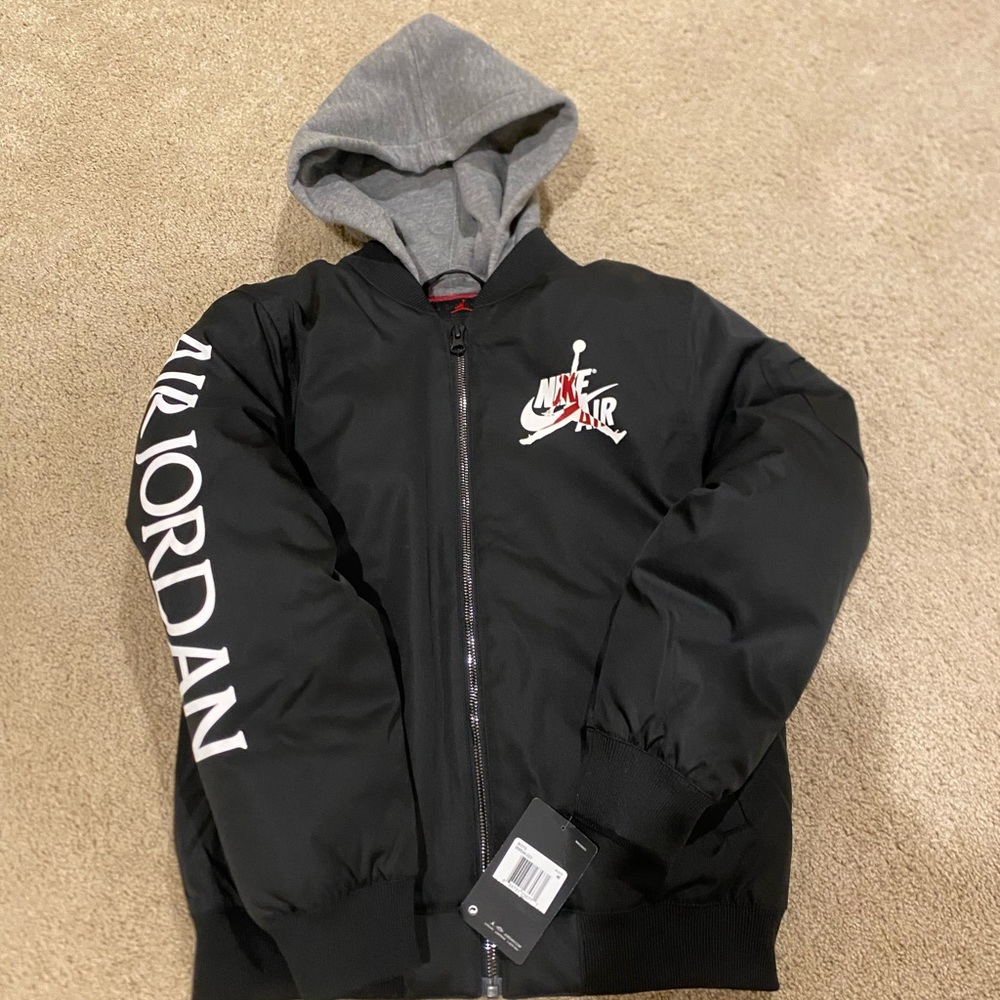 Nike Air Jordan Jacket. Big Kids size Medium in black. Brand New w/tag